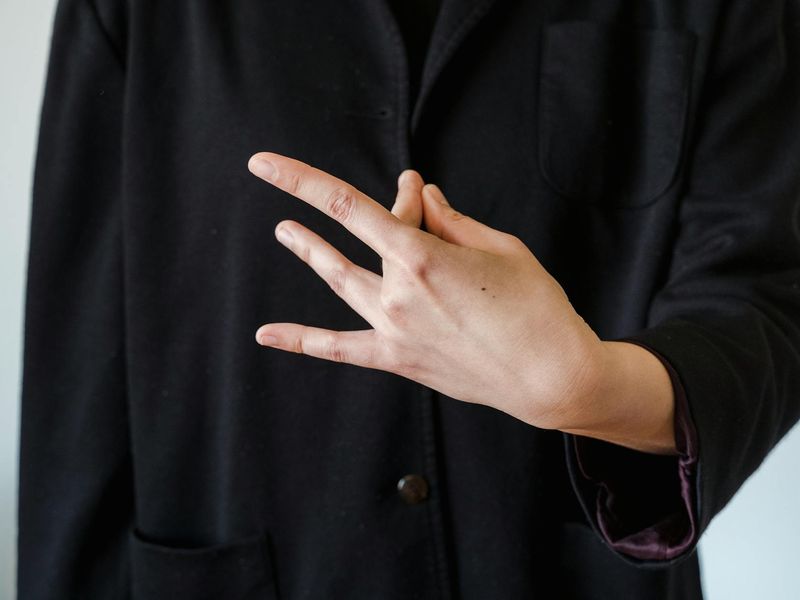Detail of hands in a mudra position during meditation